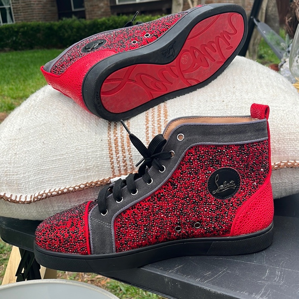 Slightly used Men size 10 Christian Louboutin high top sneaker.